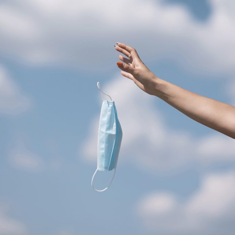 girl-throwing-out-medical-mask