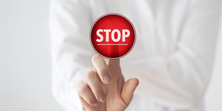 Woman pushing stop button