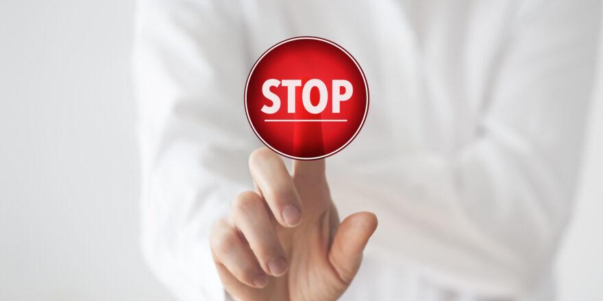 Woman pushing stop button