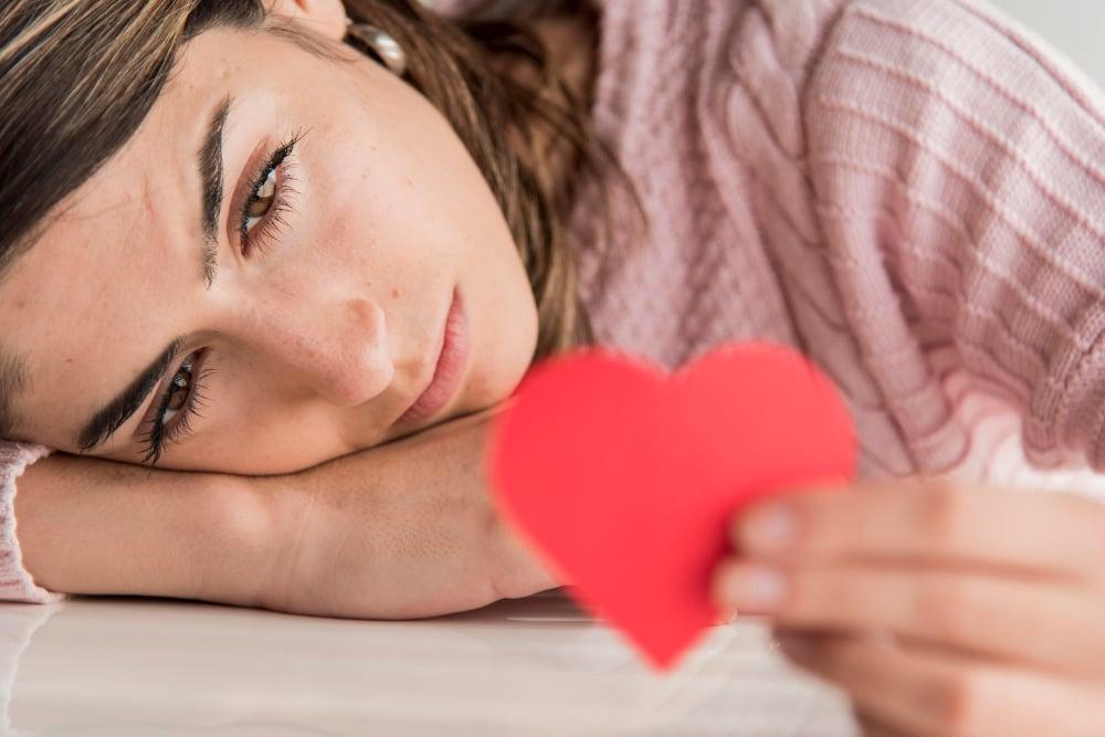 close-up-woman-holding-heart