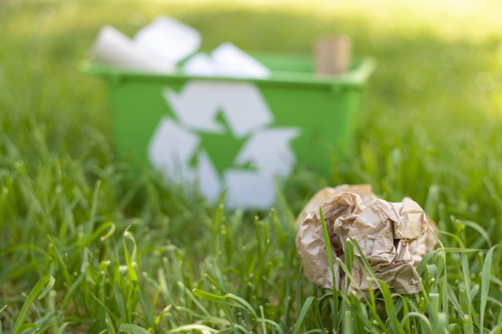 front-view-recycling-basket-grass-with-trash-scaled