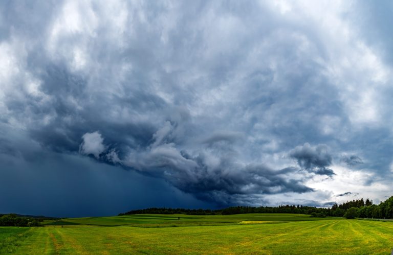 mesmerizing-view-fresh-green-fields-cloudy-sky-scaled